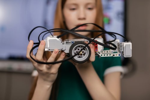 Girl holding STEM car activity